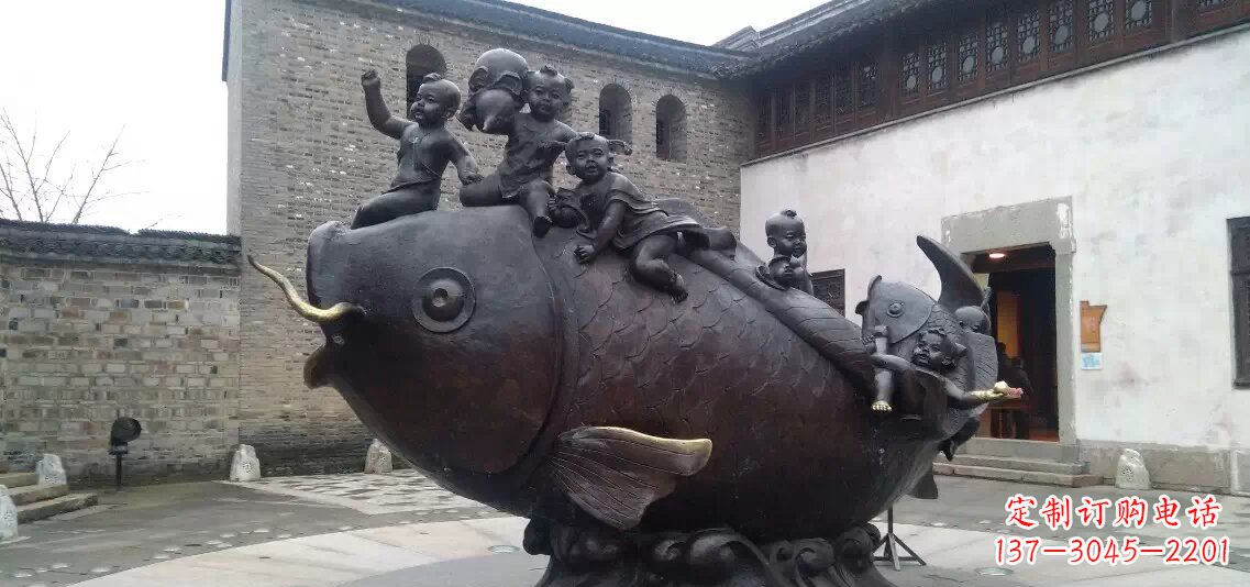 大同小孩骑鱼铜雕