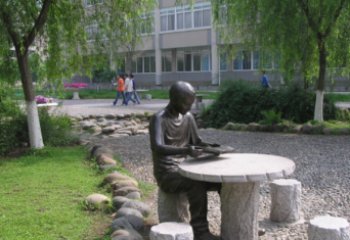大同坐石桌凳看书的学生铜雕